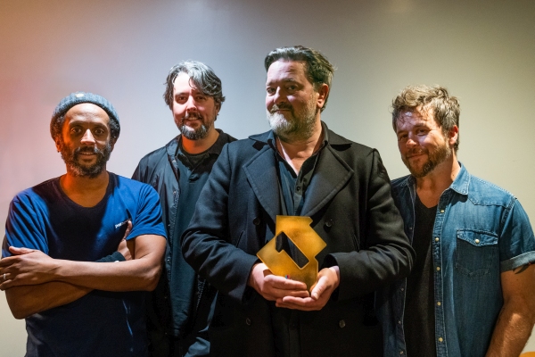 Elbow with their Official Number 1 Album Award from the Official Charts Company for Giants of All Sizes (credit: Peter Neill)