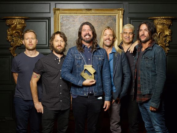 Foo Fighters with their Official Number 1 Album Award from the Official Charts Company for Concrete and Gold [credit: Danny North]