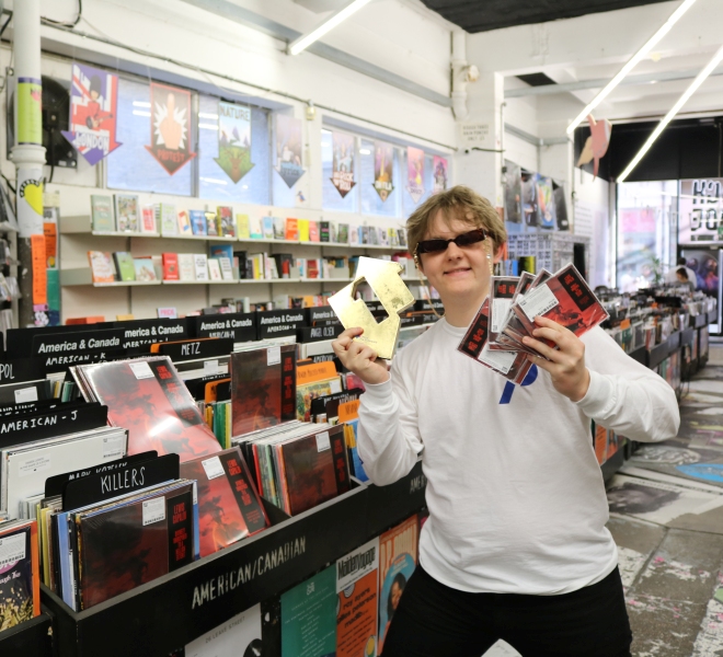 Lewis Capaldi with his Official Number 1 Award for Divinely Uninspired to A Hellish Extent (credit: Official Charts)