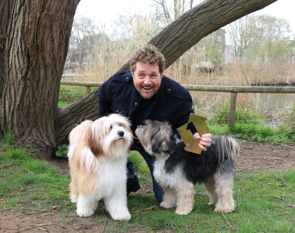 Michael Ball's dogs receive his Number One award for topping the Official UK Albums chart [Picture: Officialcharts.com]
